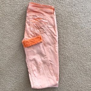 SILVER Skinny Suki jeans, faded orange colored